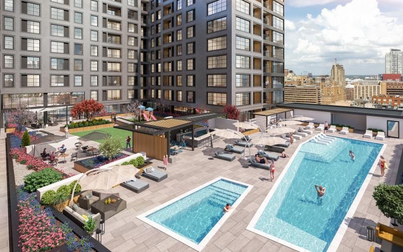 a courtyard with a pool and buildings